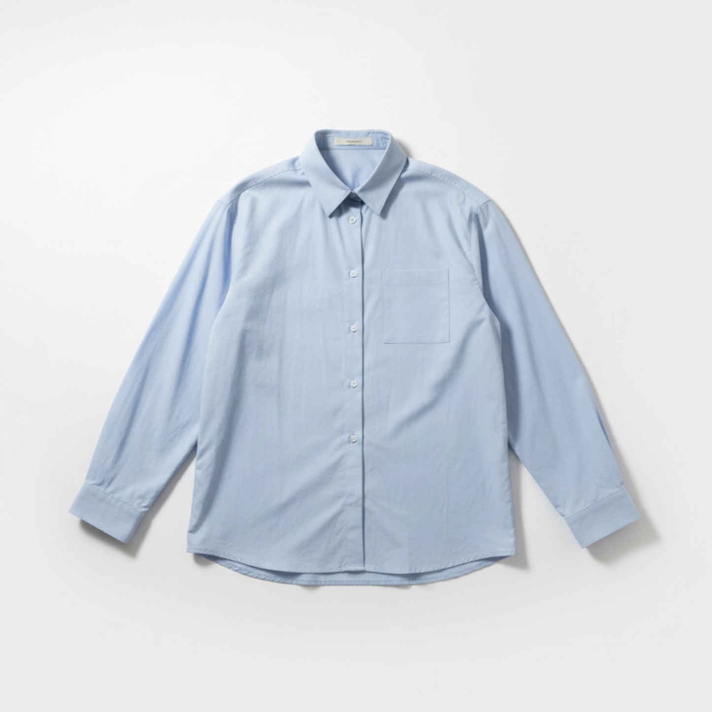 Light blue button-up shirt on a white background