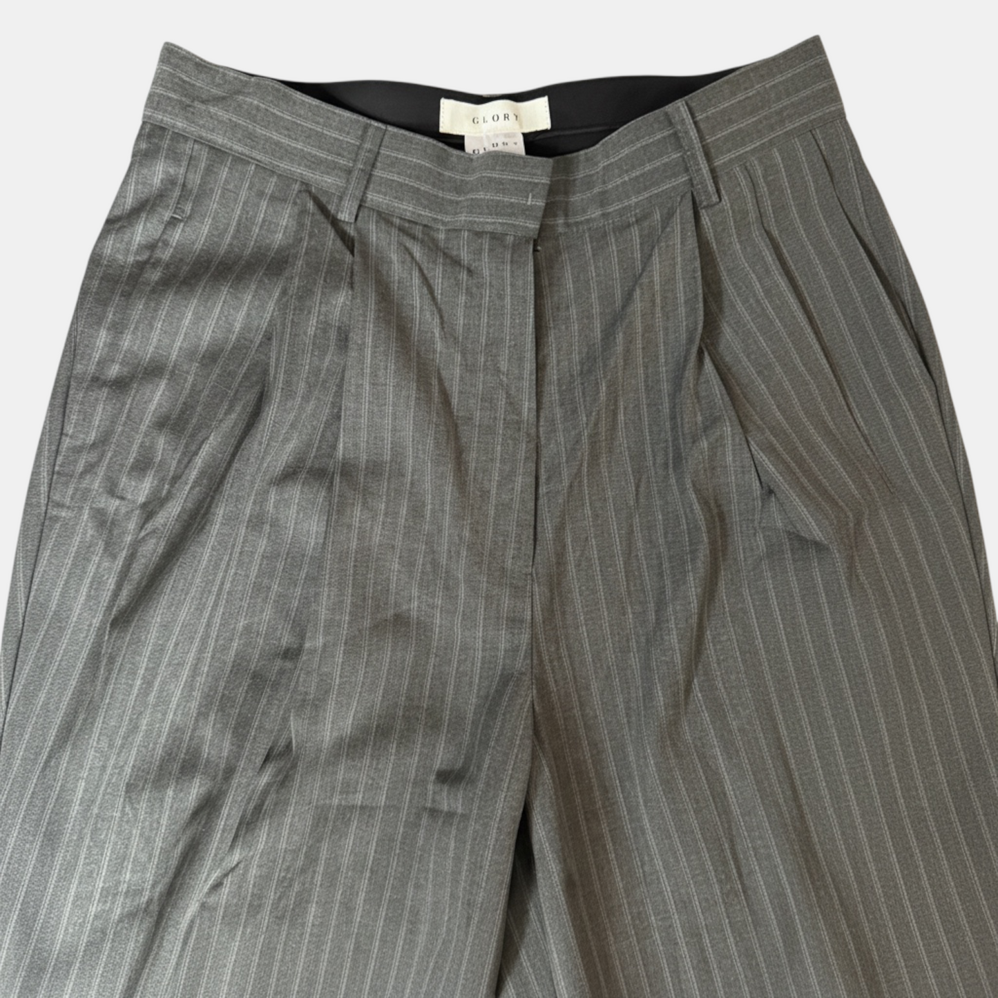 Gray pinstripe pants with a visible brand label on a white background