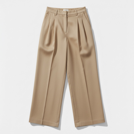 Beige pleated pants on a light gray background