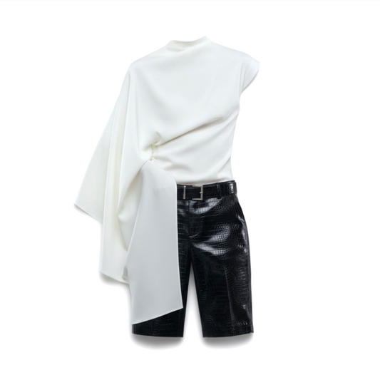 White oversized shirt with black leather shorts on a white background