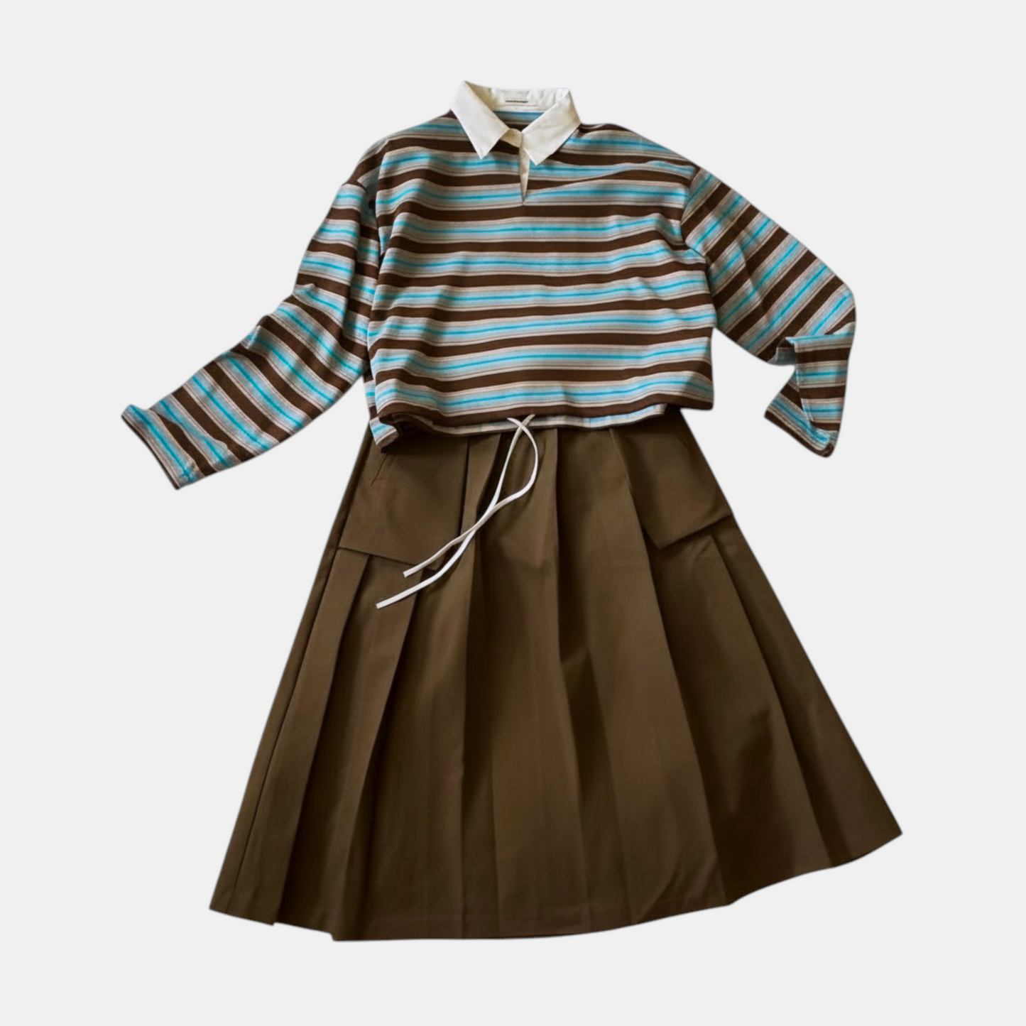 Striped shirt and brown skirt set on a white background